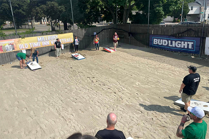 Group of people playing cornhole