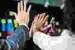People giving high fives.